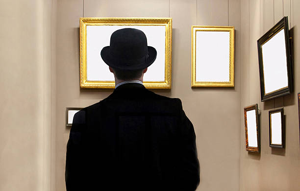 England London, man looking at blank pictures on wall