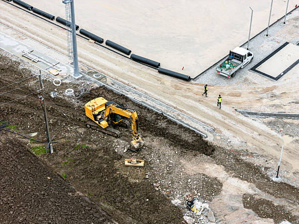 istock Aerial View of Excavator at Construction Site 2224551883