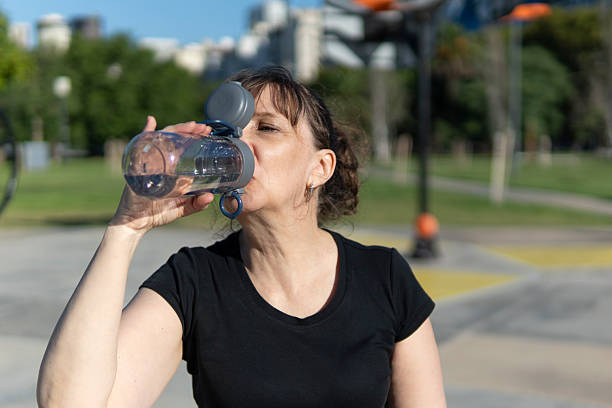 istock Senior woman staying hydrated after a workout 2224554675
