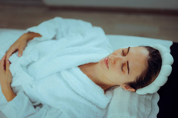 istock Woman Wearing a Bathrobe Relaxing at the Spa 2224554723