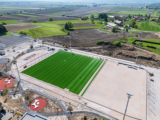 istock Workers Installing Artificial Turf on Sports Field 2224556394