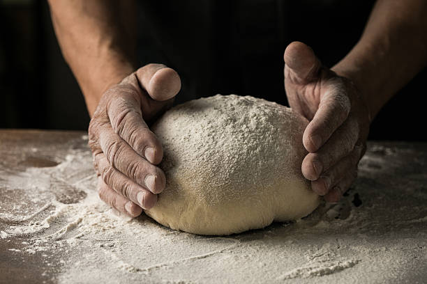 istock Elderly Hands Kneading Dough for Homemade Bread 2224561829