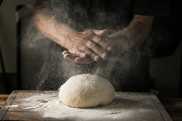 istock Elderly Hands Kneading Dough for Homemade Bread 2224561833