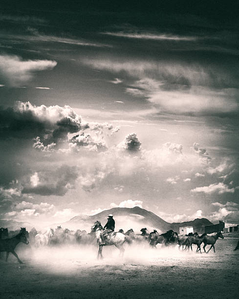 Local village man riding horse in mountainside dusty landscape in rural area of Kayseri