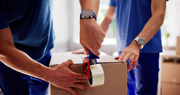 istock Hardworking Packers Wrapping Fragile Furniture 2224573312