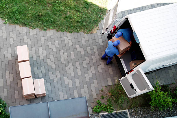 istock Busy Movers Unloading Furniture From Delivery Truck 2224573382
