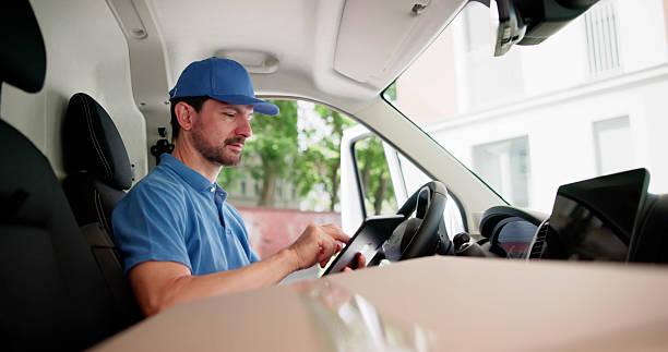 istock Speedy Courier Transporting Packages In Company Vehicle 2224573407