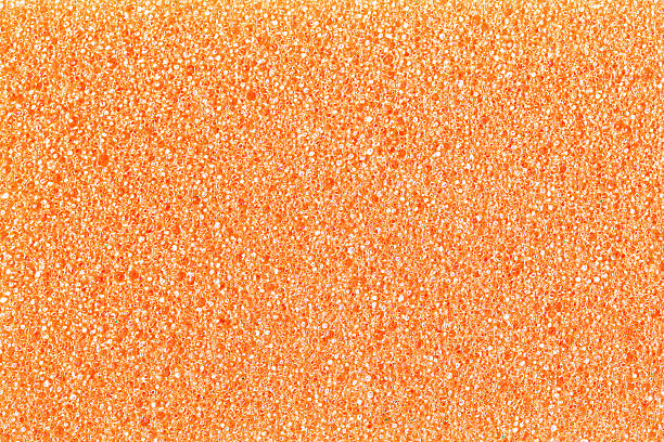 istock Yellow sponge surface texture. Close up view of porous structure. Air bubble pattern. Foam material with rough surface. 2224576142