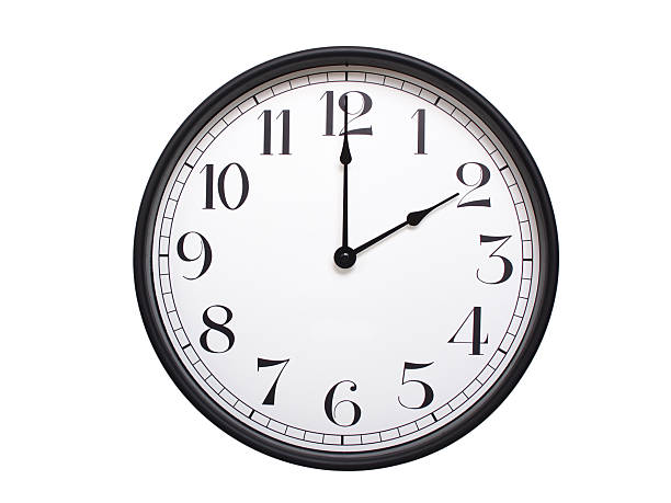 Round analog wall clock with a black frame, white face, and bold black numerals. showing  02:00 or 14:00. Isolated on a white background. Ideal for time-related themes.