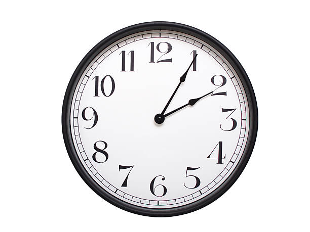 Round analog wall clock with a black frame, white face, and bold black numerals. showing  02:05 or 14:05. Isolated on a white background. Ideal for time-related themes.