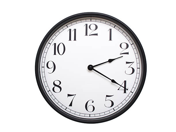 istock Round analog wall clock with a black frame, white face, and bold black numerals. showing  02:20 or 14:20. Isolated on a white background. Ideal for time-related themes. 2224577176