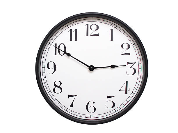Round analog wall clock with a black frame, white face, and bold black numerals. showing  02:50 or 14:50. Isolated on a white background. Ideal for time-related themes.