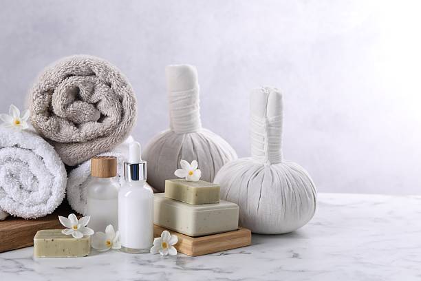 istock Composition with spa supplies and flowers on white marble table 2224578923