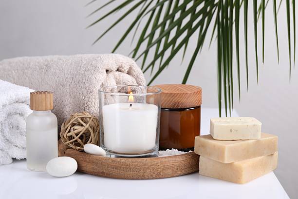 istock Composition with spa supplies on white table and palm leaf 2224578940