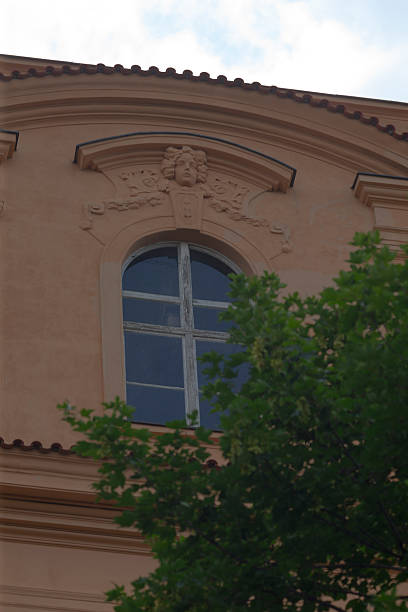 istock There is a building that features a window and a tree right in front of it 2224580914