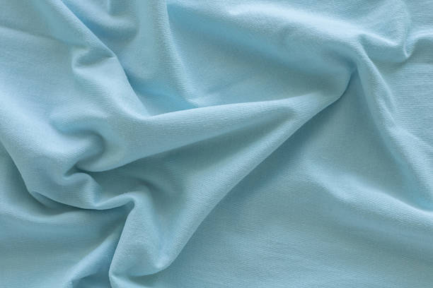 istock Litht green cotton fabric with wavy. Beautiful smooth elegant wavy, abstract background design. 2224581229