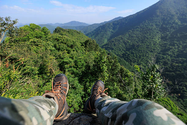 istock Successful hiker stand on sunrise mountain top cliff edge 2224581368