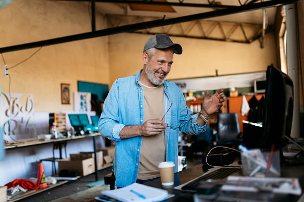 istock Mature small business owner having a video call in his workshop 2224581374