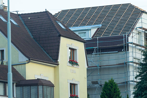 istock A yellow house with a brown roof is currently under construction 2224584482