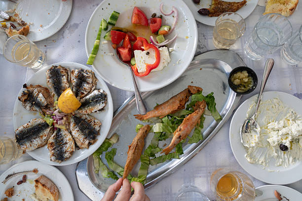 The taste of the Mediterranean - crispy fried fish paired with vibrant salad, creamy tzatziki and local white vine