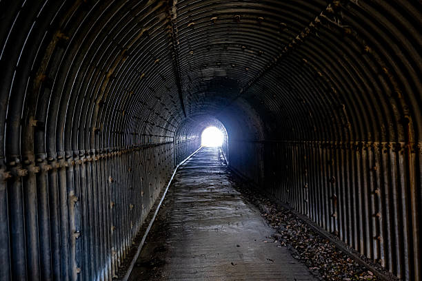 istock a dark tunnel with exposed rocks, 2224593035