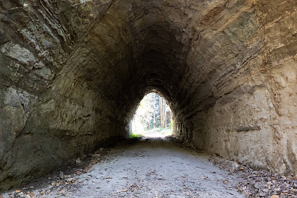 istock a dark tunnel with exposed rocks, 2224593051