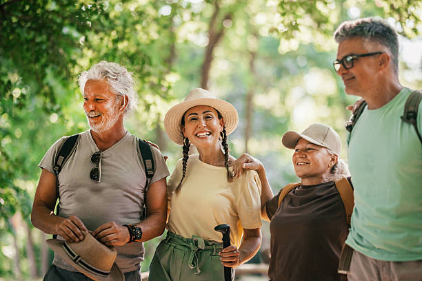 istock Active Seniors and friends  chatting during a nature hiking 2224593422