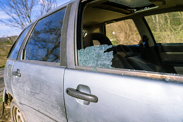 istock Broken car glass detail, view through destroyed side window, showing inside seats, aftermath of robbery, property damage issue, road crime alert 2224594143