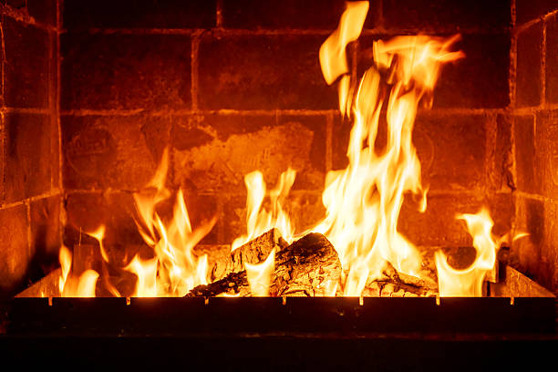 istock Crackling fire inside fireplace made of bricks, intense warmth and flame, romantic countryside interior scene, cozy home atmosphere 2224594433
