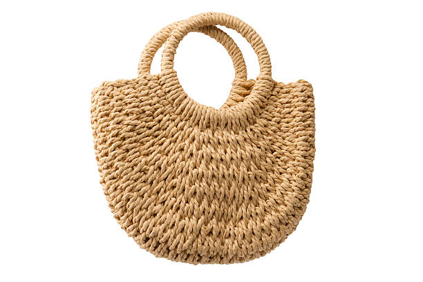 istock A beige straw bag isolated on a white background. 2224594732