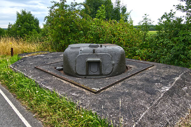 istock Old sherman tank turret embedded in concrete, repurposed as a fixed fortification in the netherlands, a relic of world war ii bridge defense 2224595410