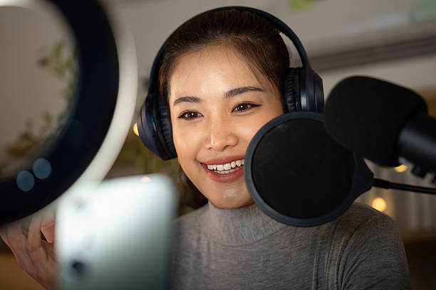 istock Podcast recording session with enthusiastic host engaging with audience 2224602774