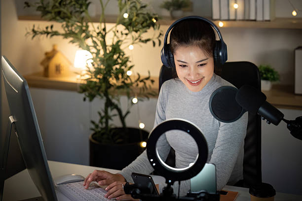 istock Podcast host preparing content in a cozy recording studio 2224602850