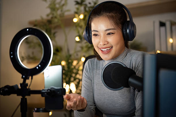 istock Podcasting. Enthusiastic woman sharing her thoughts while recording a podcast. 2224602890