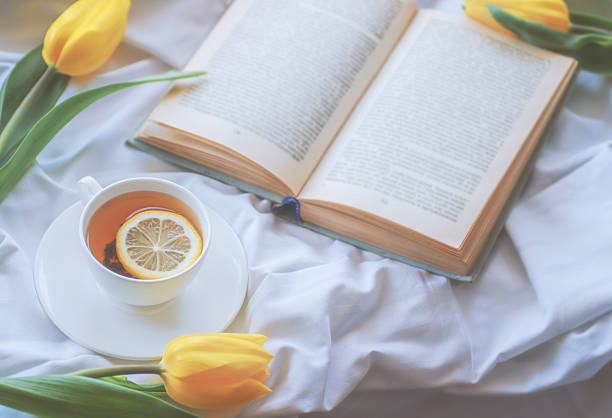 mug of hot tea and book