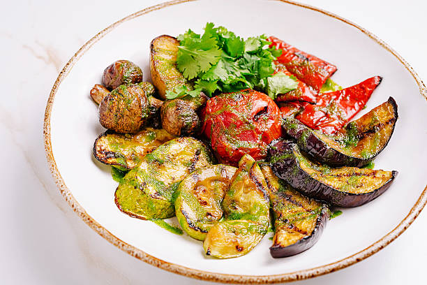 istock Grilled vegetables served on a white plate with vibrant colors and fresh herbs 2224605496
