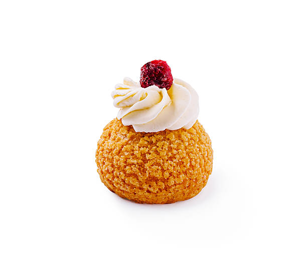 istock Delicate cream puff topped with cherry sits on white background 2224607051