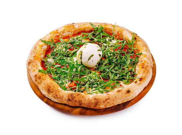 Light creamy pizza with ham slices under layer of browned melted mozzarella topped with cream cheese mixed with spicy herbs and fresh fragrant arugula leaves, top view isolated on white background
