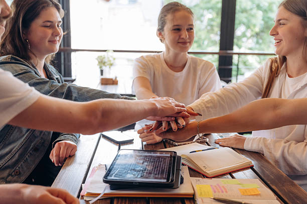 istock Teamwork conception, hands gesture. Group of young friends are in the cafe restaurant 2224610722