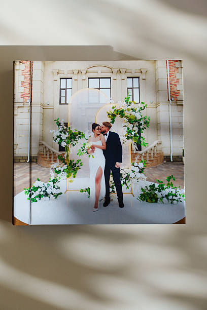 istock a closed photo book with wedding photos on a white table 2224611502