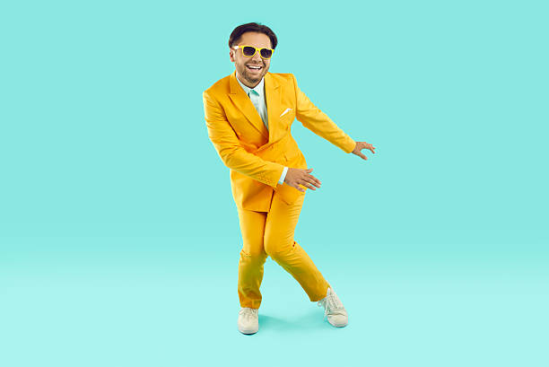 istock Happy excited young man dancing on studio background 2224611531