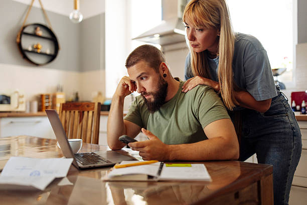 istock Concerned Couple Reviewing Finances 2224614517