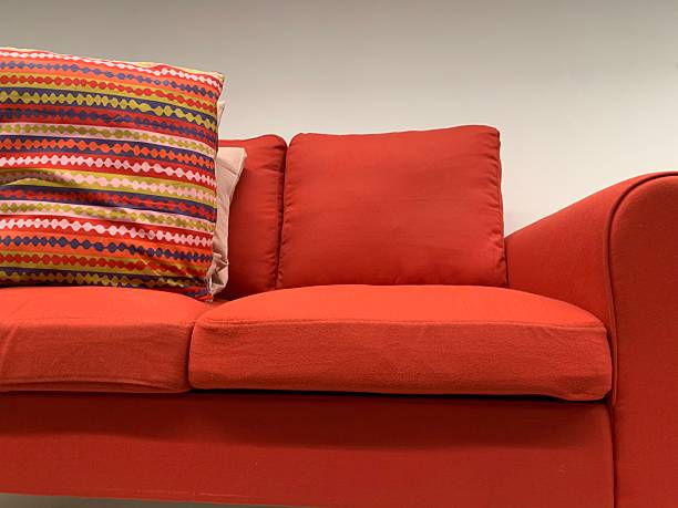 istock Bright Red Sofa with Colorful Geometric Pattern Pillow for Modern Interiors 2224615337