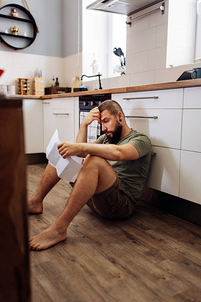 Worried Man Reviewing Finances