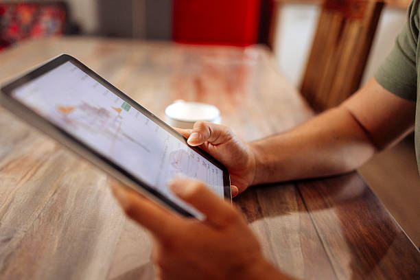 istock Man Managing Finances on Digital Tablet at Home 2224616258