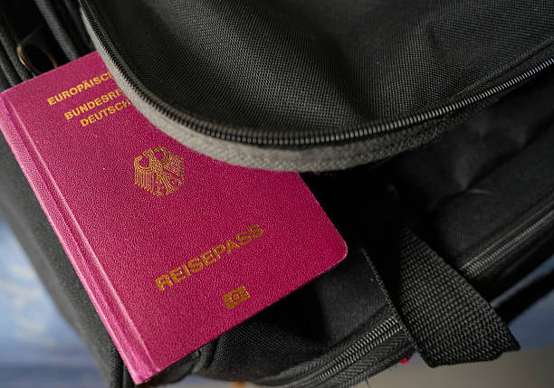 Germany. July 11, 2025. German passport on a  travel bag symbolizing freedom, mobility, and readiness for international adventures and new destinations