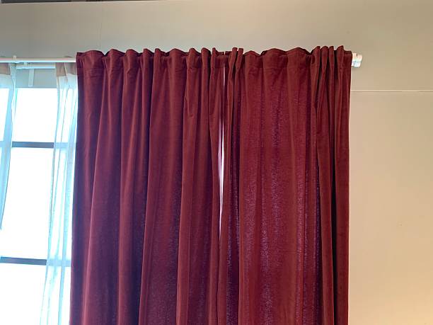 istock Maroon Room Darkening Curtains on Window Rod 2224618769