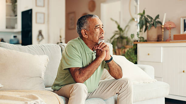 istock Sad, senior man or thinking on sofa with retirement loneliness, regret decision and remember memory. Thoughtful, mental health or elderly person with depression in home for loss, reflection or stress 2224622386