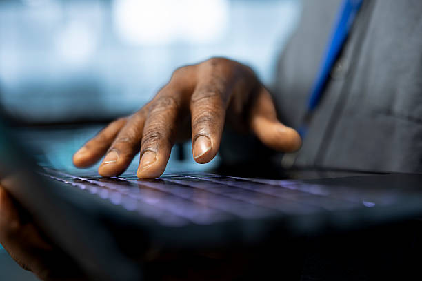istock Close up of engineer in server room typing on laptop keyboard 2224624465