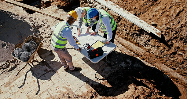 istock Above, blueprint and team on construction site for planning, check design and engineering collaboration. Architect people, building layout and outdoor in meeting for brainstorming, compliance or PPE 2224624472